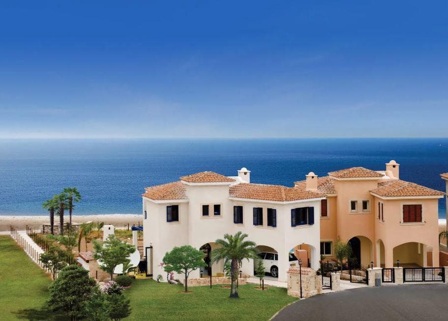 Complex of beachfront villas with swimming pools and gardens