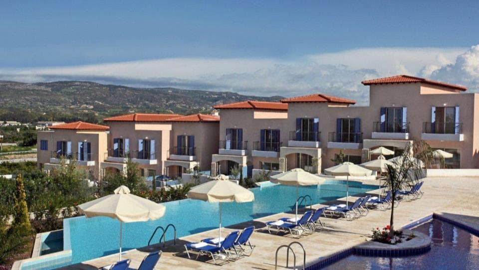 Complex of townhouses with swimming pools and a green area