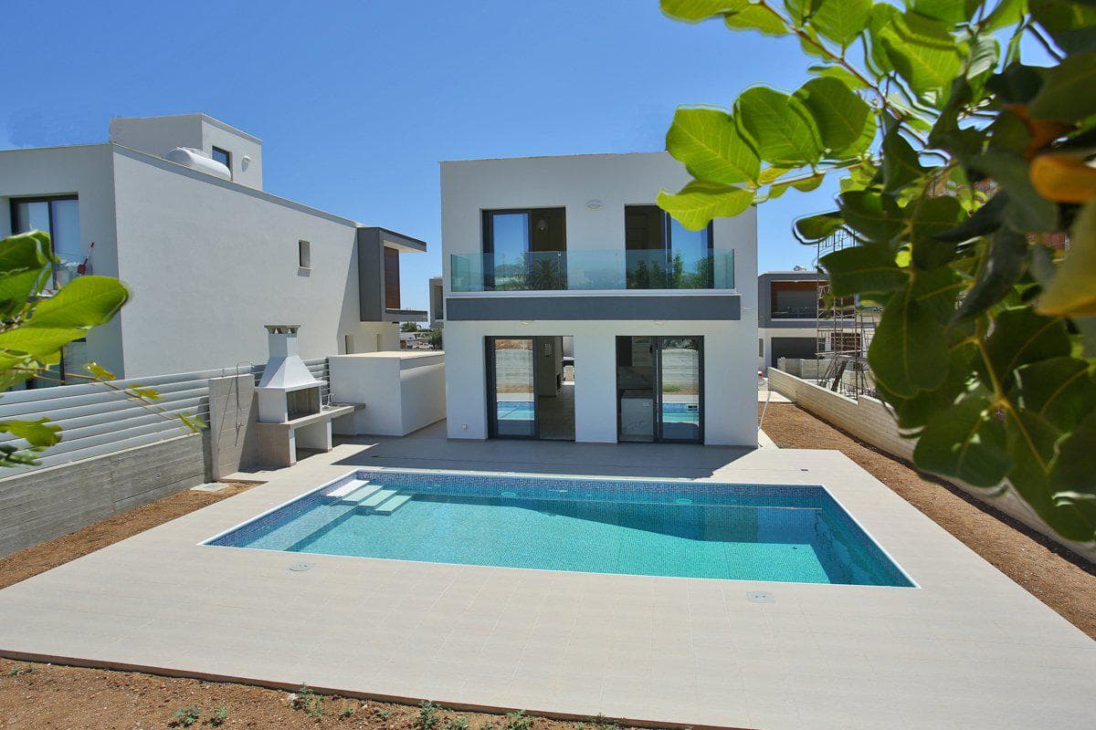 Complex of modern villas close to a golf course